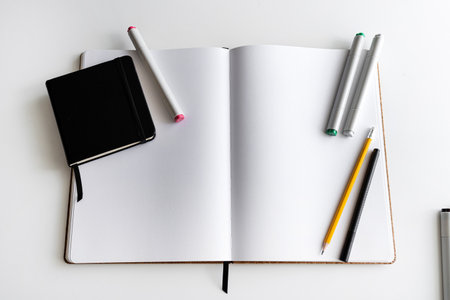 Open notebook with stationery for creative work. Concept of a new chapterの写真素材