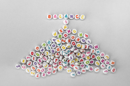 This captivating image showcases the word BALANCE creatively spelled out with colorful alphabet...