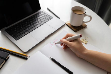 Organized home office desk with coffeeの写真素材