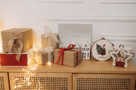 Christmas Gifts and Decorations on a Wooden Cabinetの写真素材