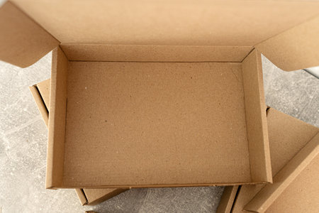 Open kraft cardboard box showing empty interiorの写真素材