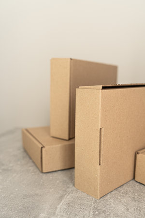 Eco-friendly kraft cardboard boxes arranged for sustainable packaging solutionsの写真素材