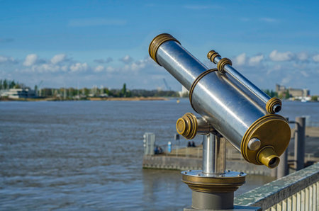 View of the Shelda River from the viewing platform of the wharf of Antwerp. Telescope with landscapeの写真素材