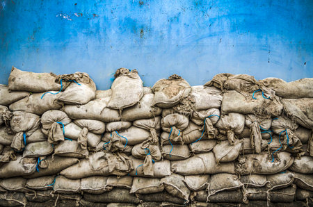 Old sandbag wall for flooding defense or fortification,の写真素材