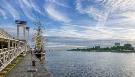 ANTWERP, BELGIUM - 25 JUNE, 2017: Promenade and pier in Antwerp with signs Anwerpen Antwerp in dutch...