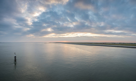 Beautiful and colorful sunset sky over the North Sea, Hollandの写真素材