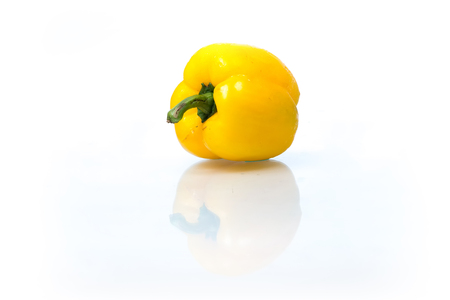 Yellow capsicum or bell peppers isolated on white backgroundの写真素材