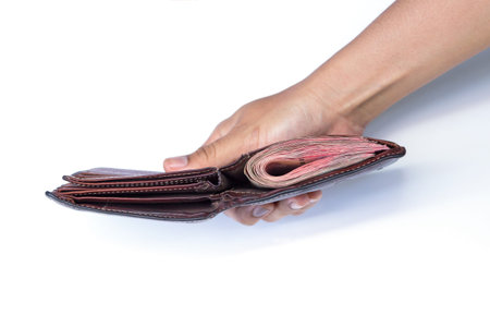A wallet with a certain amount of money in the hands of men on white background