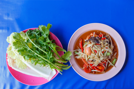Papaya salad on table,National food of Thailand,Papaya salad and grilled Chickenの写真素材