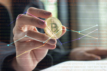 Golden bitcoin is placed on hands of business young woman,Closeup bitcoin select focus and blur...
