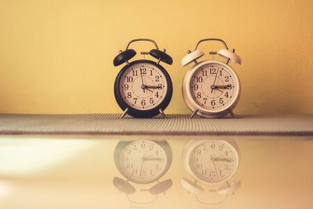 Close up alarm clock with reflection on ground, Vintageの写真素材
