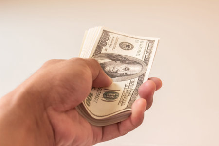 Young man prepare dollar to pay shopping, Dollar is in hands of men,