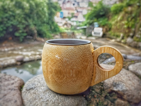 Cup of tea on the stone in the garden with nature backgroundの写真素材