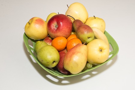 Colored fruits on table.の写真素材