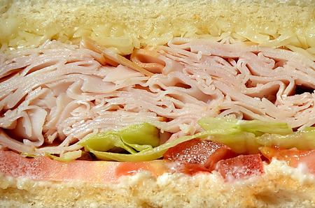 detail of sandwich with ham, salad and tomatoの写真素材