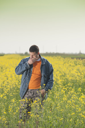 Farmer in rapesees fieldの写真素材