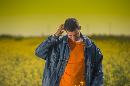 Farmer in rapesees fieldの写真素材