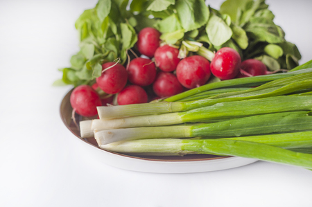 Bunch of radish and spring onionの写真素材