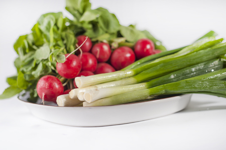 Bunch of radish and spring onionの写真素材