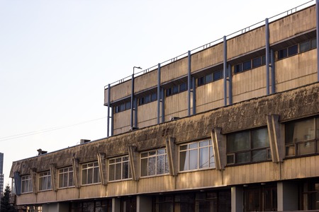 New high modern constructed city buildings over clear cloudless blue sky front viewの写真素材
