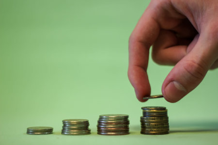 Human Hand human hand putting coin to money, business ideas, on a green background