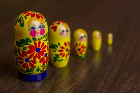 Russian nesting dolls,  babushkas or matryoshkas on wooden backgroundの写真素材