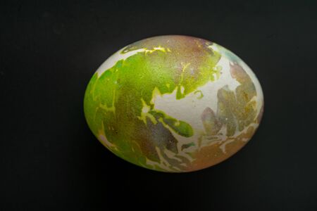 black egg lies on white background white egg lies on black backgroundの写真素材