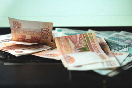Russian money against the background of the dynamics of the exchange rateの写真素材