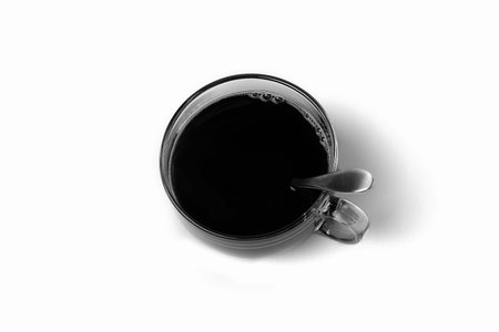 Transparent cup of coffee standing on white background