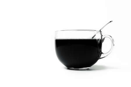 Transparent cup of coffee standing on white backgroundの写真素材