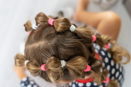 A beautiful hairstyle on the girls head.