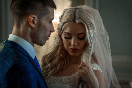 Wedding of a beautiful young couple,couple in love looks one-on-oneの写真素材