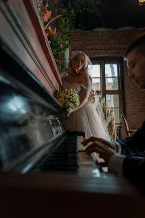 Wedding of a beautiful young couple,couple in love looks one-on-oneの写真素材