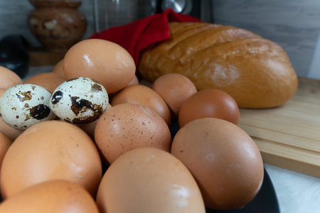 Fresh homemade chicken eggs lie on a server plate