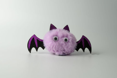 Cute purple little fluffy bat with plastic eyes