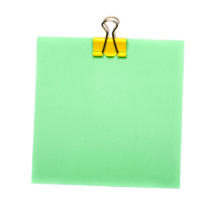 green Stick Note with yellow paper clip holder isolated on white background. Mock up.の写真素材