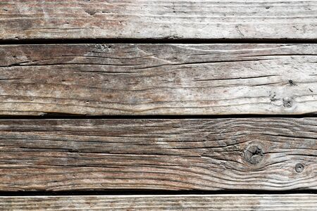 Texture of old weathered wooden planks. Cracks in wall of rural house. Free text spaceの写真素材