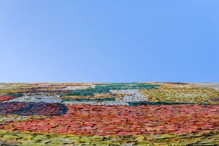 Multicolored abstract mosaic surface with high resolution with empty blue background. Mock up template for display or montage of product.の写真素材