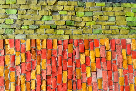 Matte smalt mosaic decorates wall of building. Multi-colored abstract, geometric background for your design with copy space and place for text. Fashion texture.の写真素材