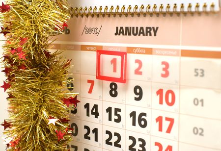 Sheet of a calendar for January, 2010 decorated with a tinsel.の写真素材