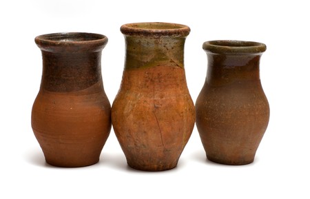 Three of the old earthen bowls isolated on a white background.の写真素材