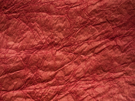 Red crumpled paper texture (for background)の写真素材