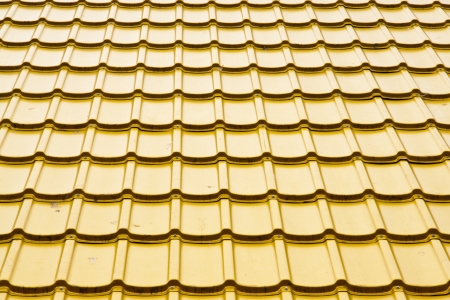 Brand new yellow rooftop against の写真素材