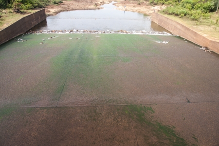 view of a gate in an irrigation canal の写真素材