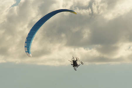 A paraglider on a flight in the clear skyのeditorial素材