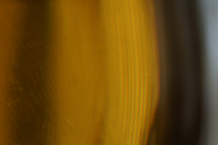 Beer - Wet glass of beer, background, golden color in the dark