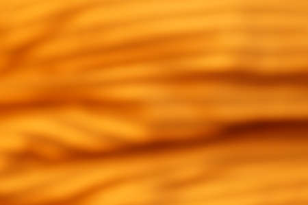 Abstract graphic background with dominant orange, gold and brown colorsの写真素材