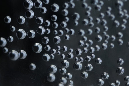 Large air bubbles in a dark space with a metallic glow