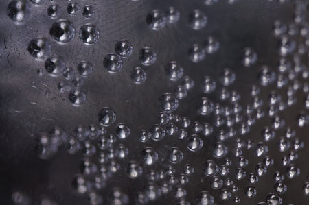 Waterfall of glass, metallic balls in a mysterious space