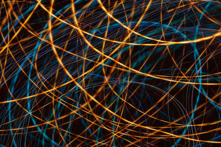 Luminous streamer - neon bright lines on black background.の写真素材